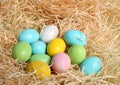 Coloured easter eggs on the straw