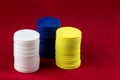 Gaming Chips Stacked on a Red Table Cloth Royalty Free Stock Photo