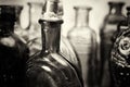 Coloured glass bottles on a rustic background Royalty Free Stock Photo