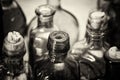 Coloured glass bottles on a rustic background Royalty Free Stock Photo