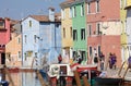 Coloured houses along the channel at Burano, island in the Venetian Lagoon, Venice, Italy