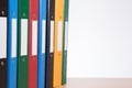 Coloured office document folders on shelf closeup Royalty Free Stock Photo