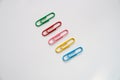 Coloured paper clips on a white background Royalty Free Stock Photo
