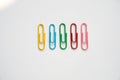 Coloured paper clips on a white background Royalty Free Stock Photo
