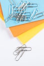 Coloured paper with paperclips on top Royalty Free Stock Photo