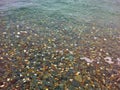 Coloured Pebbles in Clear Sea Water