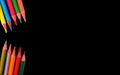 Coloured pencils on black background Royalty Free Stock Photo