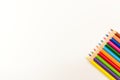 Coloured pencils lined up on white background, close-up. Royalty Free Stock Photo