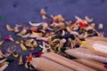 Coloured pencils and shavings against a black background Royalty Free Stock Photo