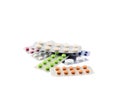 Coloured pills on whitebackground.