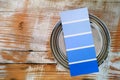 Coloured swatch for tinting on paint can. Wooden background Royalty Free Stock Photo