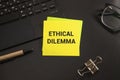 A coloured wooden block with text ETHICAL DILEMMA Royalty Free Stock Photo