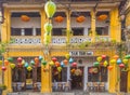 Colourful architecture and lanterns along streets of Hoi An Ancient Town during the day