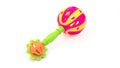 Colourful baby rattle with balls. White isolated background. Royalty Free Stock Photo