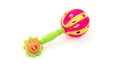 Colourful baby rattle with balls. White isolated background. Royalty Free Stock Photo