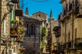 Colourful balconies, narrow medieval streets and the twin spires of the church of Saint Maria in Petralia Soprana, Sicily Royalty Free Stock Photo