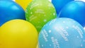 Colourful Balloons In Blue Yellow Apple Green And Turquoise With Happy Birthday Text