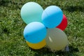 Colourful balloons at a children playground, in direct sunlight, blue, yellow, red and pink mixed balloons Royalty Free Stock Photo