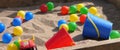 Colourful balls buckets and spades in childs sand pit Royalty Free Stock Photo