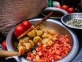 Colourful Bangladesh street food with tomato, beans and potato