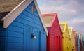 Row of multi coloured beach huts.