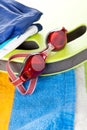 Colourful beach towel and swimming goggles