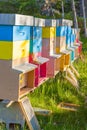 Colourful beehives in a field. Summer season.