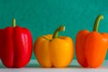 Colourful bell peppers in front of a colourful background Royalty Free Stock Photo