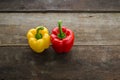 Colourful bell peppers on wooden panel Royalty Free Stock Photo