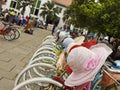 Colourful bicycles and hats for hire