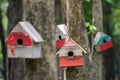 Colourful birdhouse in the green garden