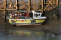 A colourful boat moored in the river Rother at Rye Harbour, East Sussex