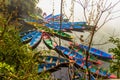 Colourful boats at shore of beautiful Phewa lake. Pokhara, Nepal. Concept of calm and serenity Royalty Free Stock Photo