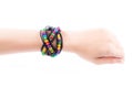 Colourful bracelets on female hand