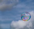 Colourful bubble floating in the air with blue sky background