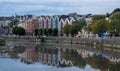 Colourful buildings reflected on bank of river lee. Cork Ireland cityscape europe Royalty Free Stock Photo