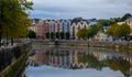 Colourful buildings reflected on bank of river lee. Cork Ireland cityscape europe Royalty Free Stock Photo