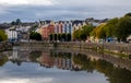 Colourful buildings reflected on bank of river lee. Cork Ireland cityscape europe Royalty Free Stock Photo