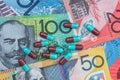 Colourful capsuled tablets on australia dollar