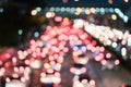 Colourful car traffic light bokeh on the street at night, abstract blurred glow city background Royalty Free Stock Photo
