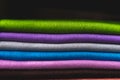 Colourful cashmere textile products in a pile