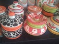 Colourful ceramic pots displayed in Indian handicraft exhibition shop Indian pottery