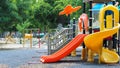 A colourful children playground equipment play ground in park.