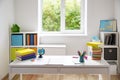 Colourful children rooom with white walls and furniture