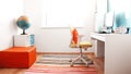 Colourful children rooom with white walls and furniture