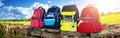 Colourful children schoolbags outdoors on the field