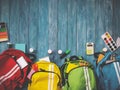 Colourful children schoolbags on wooden floor