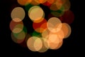 Colourful Christmas Bokeh Lights On Black Background. Red Green Orange Circles Royalty Free Stock Photo