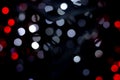 Colourful of city night lights blurred bokeh background. Defocused abstract white and red christmas texture Royalty Free Stock Photo