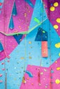 Colourful Climbing wall with ropes